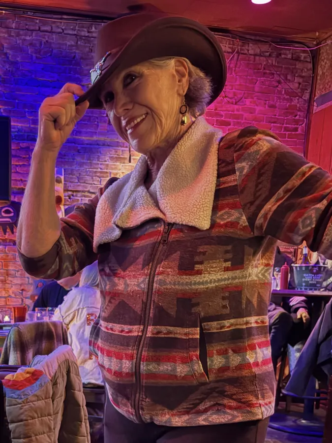 Llolyn dancing in a cowboy hat