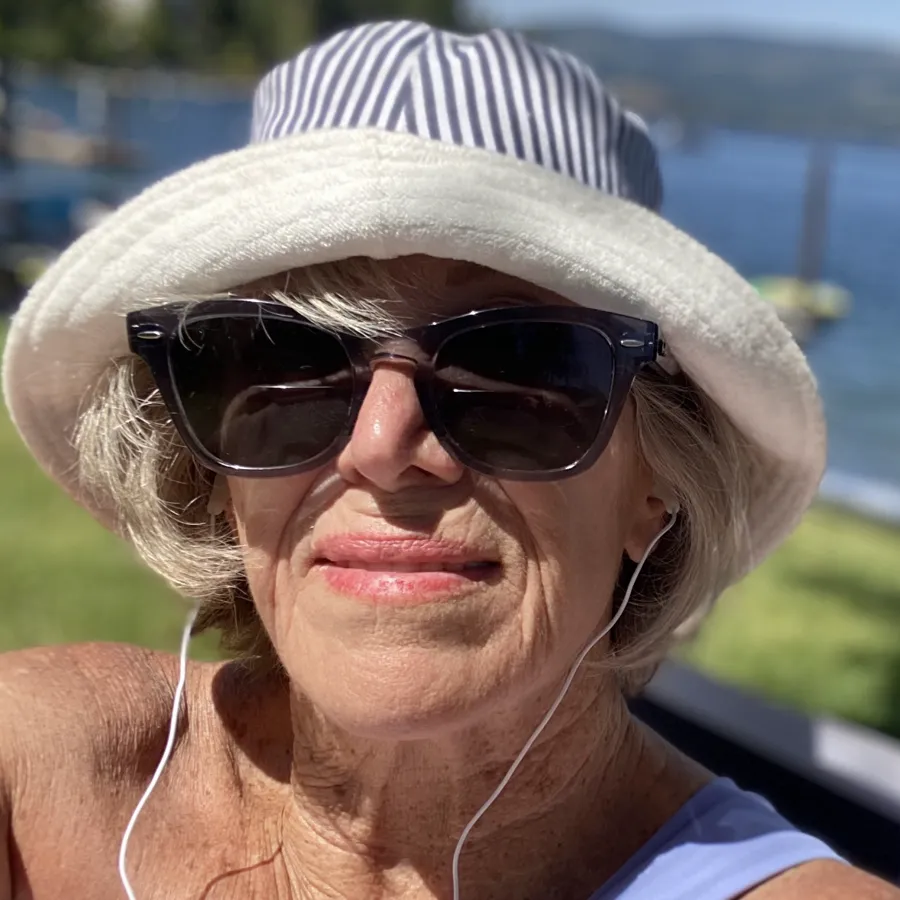 Llolyn on the lake in a sun hat