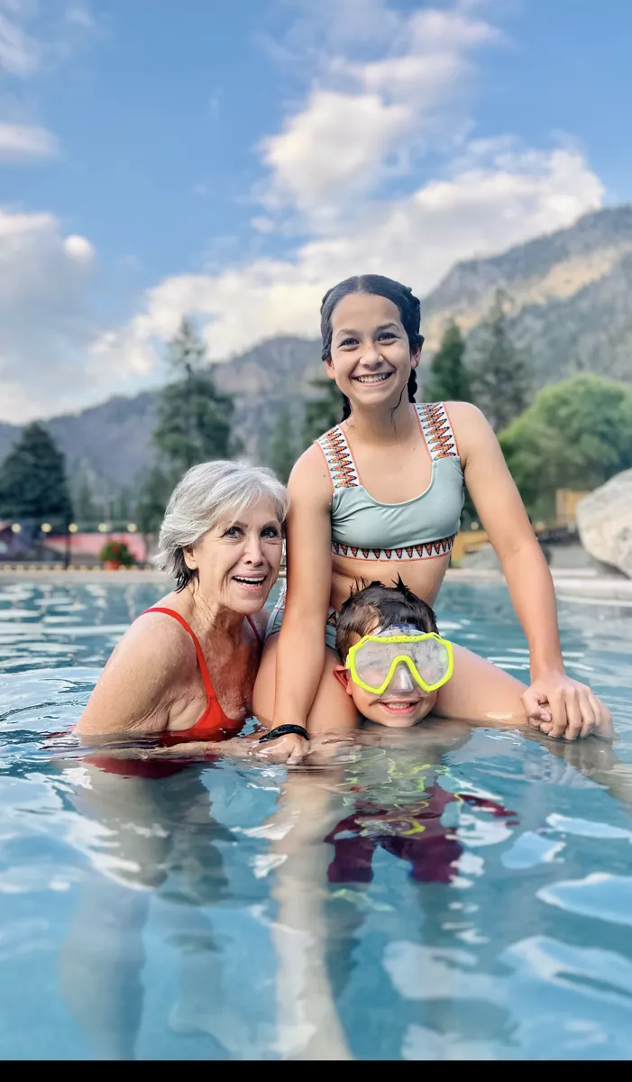 Llolyn in the pool with her grandkids